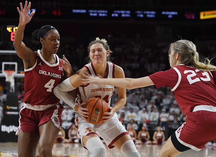 Iowa State Cyclones guard Ashley Joens (24) drives to the basket between Oklahoma Sooners guard Kennady Tucker (4) and Oklahoma Sooners guard/forward Skylar Vann (24) during the third quarter at Hilton Coliseum, Saturday, Feb. 19, 2022, in Ames, Iowa.